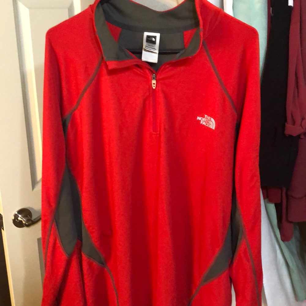 Red and gray north face jacket
